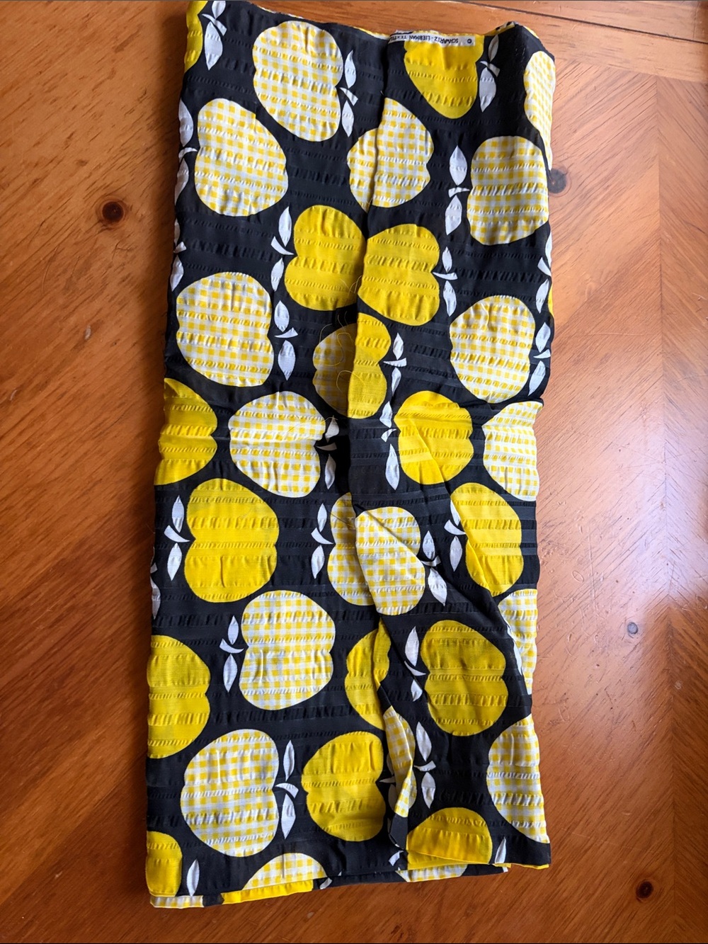 Fabric, 44โ W x 137โ L, Cotton, Black with Yellow Apples